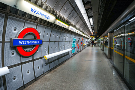 LONDON, UK - SEP 01, 2024- Westminster underground station and platform station with westminster sign.のeditorial素材