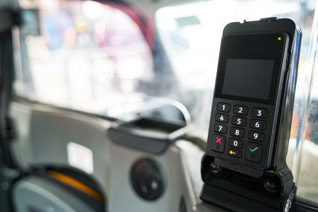 POS payment terminal or credit card reader on a taxiの写真素材