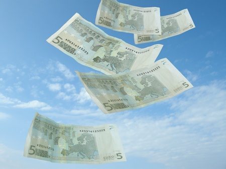 money falling from blue skyの写真素材