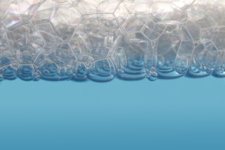 soap bubbles on blue water