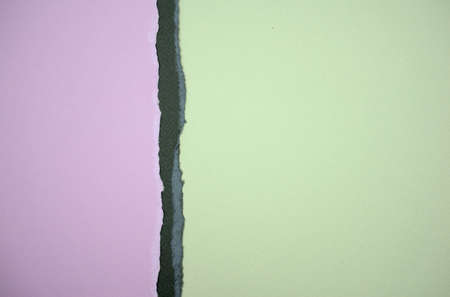 Pastel purple, dark gray, and light green torn papers abstract texture background. Empty matte...