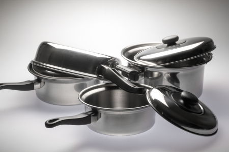 Clean and shiny stainless steel pots and pans.の写真素材