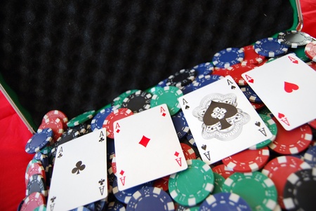 poker of aces against a background of casino chipsのeditorial素材