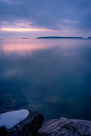 A little ice and snow on the coastの写真素材