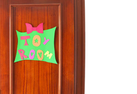 Wooden door with a handcraft sign that says toy roomの写真素材