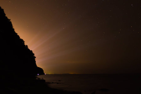 city lighting behind the rockの写真素材