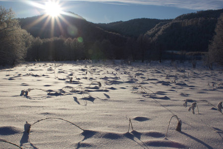 Sunrise over mountain ridge in winterの写真素材