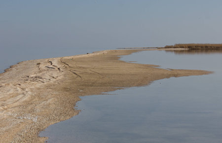 Sand bank with calm waterの写真素材