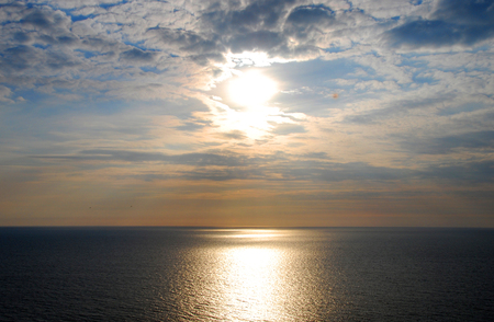 Beautiful Golden Sunset or Sunrise over the rippling Oceanの写真素材