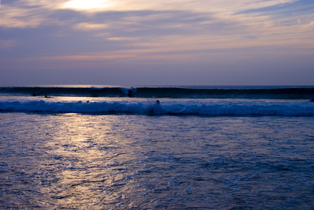 Beautiful Golden Sunset or Sunrise over the rippling Oceanの写真素材