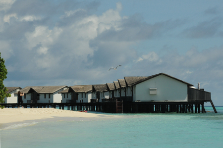 Holiday water huts over sea in the Maldivesの写真素材