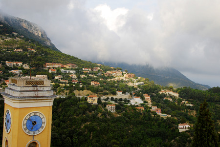 Clocktower with view over french mountainsの写真素材