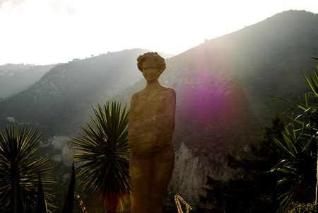 Statue portrait high up with mountain viewの写真素材