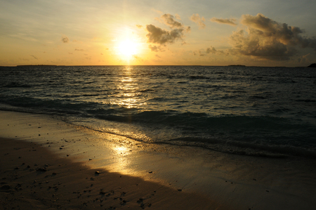 Beautiful Golden Sunset or Sunrise over the Oceanの写真素材