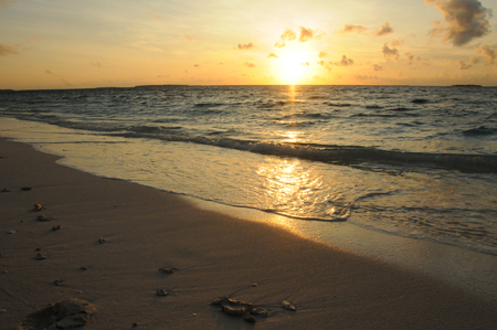 Beautiful Golden Sunset or Sunrise over the Oceanの写真素材