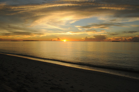Beautiful Golden Sunset or Sunrise over the Oceanの写真素材