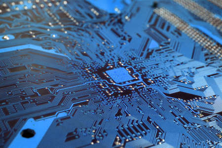 A close up of a blue computer circuit. 