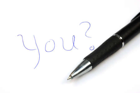 Written on paper question YOU? and pen next to itの写真素材