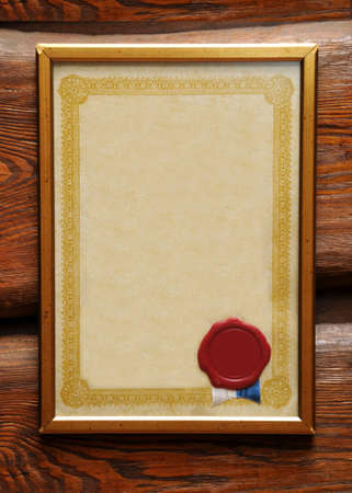 Blank certificate in frame with blank wax seal.の写真素材