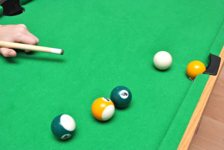 Playing the billiard on table