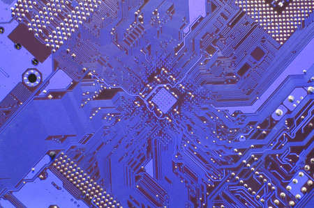 A close up of a blue computer circuit. 