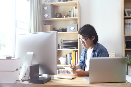 The Asian man working at the working area.の写真素材