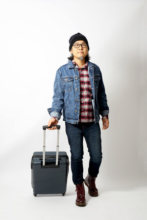 The Asian man standing in the white backgroundの写真素材
