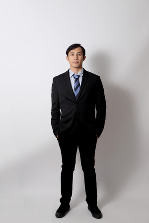 The Asian businessman on the white background.の写真素材
