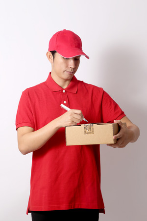 The Asian postman on the white background.