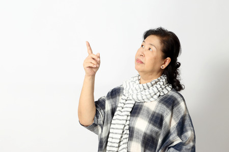 The elder Asian woman on the white background.の写真素材