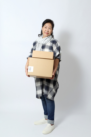 The elder Asian woman on the white background.の写真素材