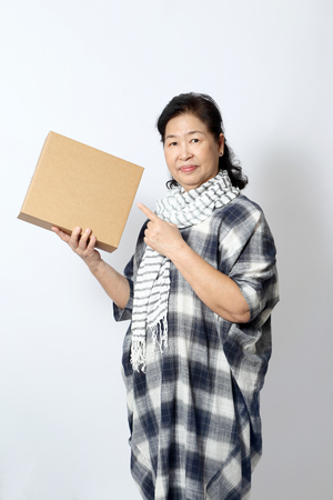 The elder Asian woman on the white background.の写真素材