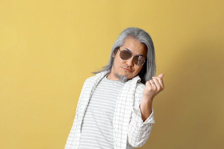 The Asian man on the colorful background.