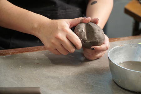 The Asian woman doing craft design works.