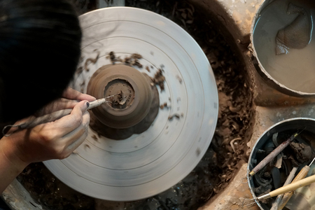 The Asian woman doing craft design works.