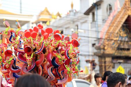 Bangkok, Thailand -February 10, 2013: The hawker selling Chinese paper toys at the Yaowarat street, Thailand.のeditorial素材