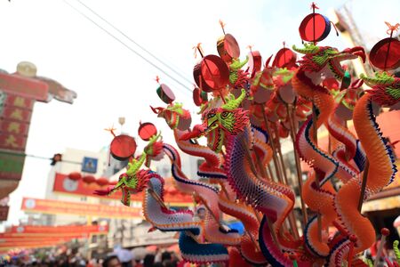 Bangkok, Thailand -February 10, 2013: The hawker selling Chinese paper toys at the Yaowarat street, Thailand.のeditorial素材