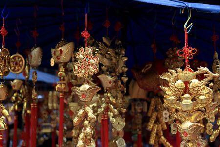 Bangkok, Thailand -February 10, 2013: The Chinese mobiles hanging in front of the Chinese sourvenir shop.のeditorial素材
