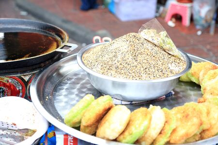 Bangkok, Thailand -February 10, 2013: Thai desserts cooked in the hot oil.