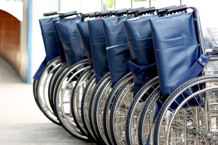 The group of wheelchairs parking.