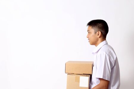 The young Thai student boy on the white background.の写真素材