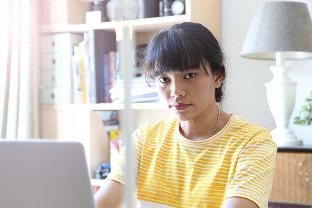 The Asian woman working in home studio.