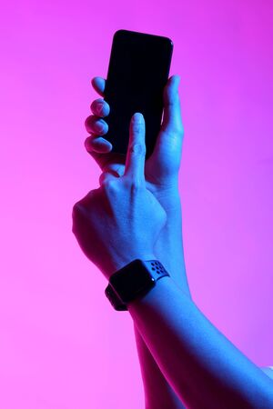 The Asian man's hands posing on the white background with vivid color.の写真素材