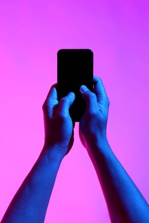 The Asian man's hands posing on the white background with vivid color.の写真素材