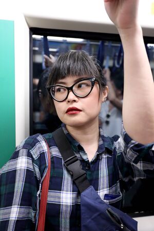 The Asian woman traveled by train.の写真素材