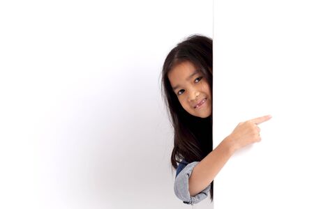 The Asian girl standing on the white background.の写真素材
