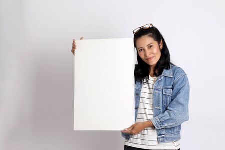 The middle aged Asian woman on the white background.