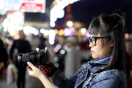 The Asian woman taking the photo at street food in Da Lat, Vietnam.