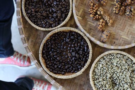 The coffee bean processed in the bamboo tray.の写真素材