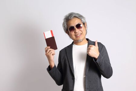 The adult Asian man on the white background.の写真素材